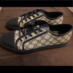 Gucci low tops..worn once still new